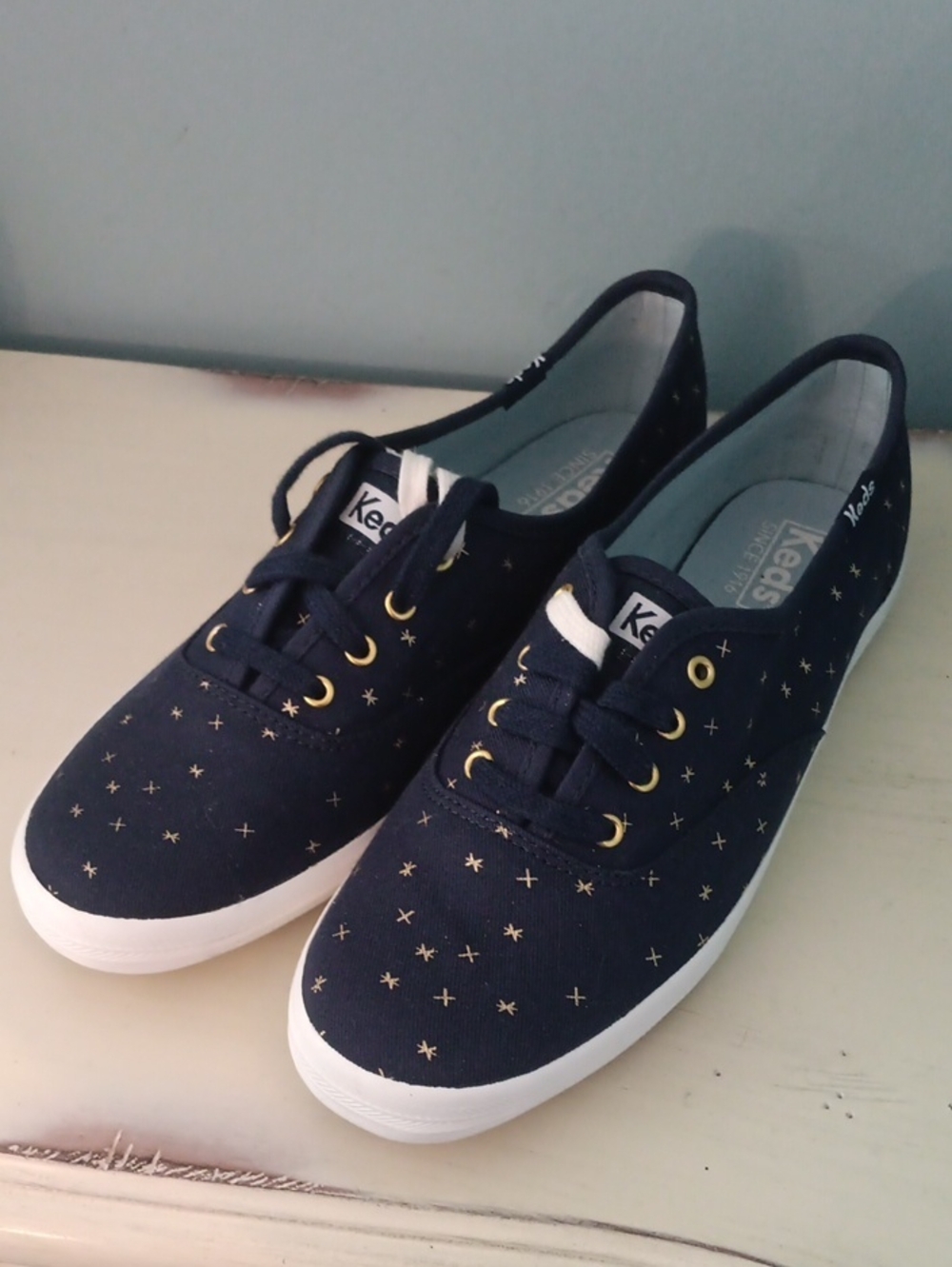 ^ Keds Navy Canvas Sneakers with Metallic Gold Accents